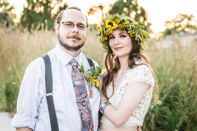 Bride wearing a floral crown and groom wearing a boutonniere, both created by District 2 Floral Studio with Nebraska locally grown native perennial flowers. 