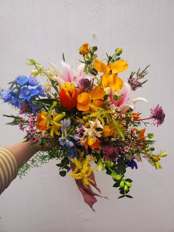 Colorful wedding bridal bouquet by District 2 Floral Studio using American-grown flowers.