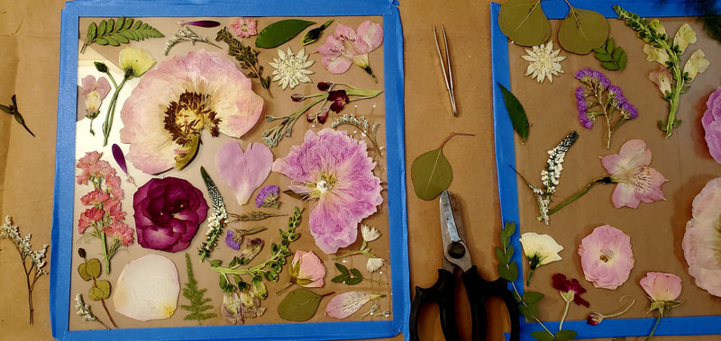Two pressed flower preservation pieces in process by District 2 Floral Studio.