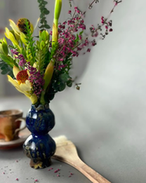District 2 Floral Studio flowers in a hand-built blue ceramic vase by Anna Stoysich.
