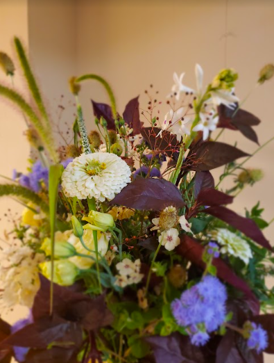 Violet, white and burgundy flower arrangement by District 2 Floral Studio created with locally grown flowers.