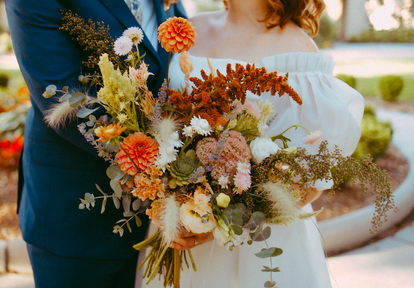 Rust orange, ivory and pastel pink September wedding bridal bouquet by District 2 Floral Studio using locally-grown flowers.