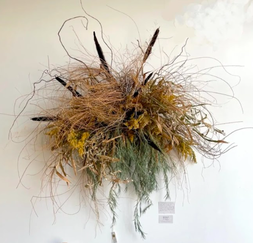 Seasonal autumn wall hanging created by District 2 Floral Studio with locally grown Nebraska dried grasses and flowers.